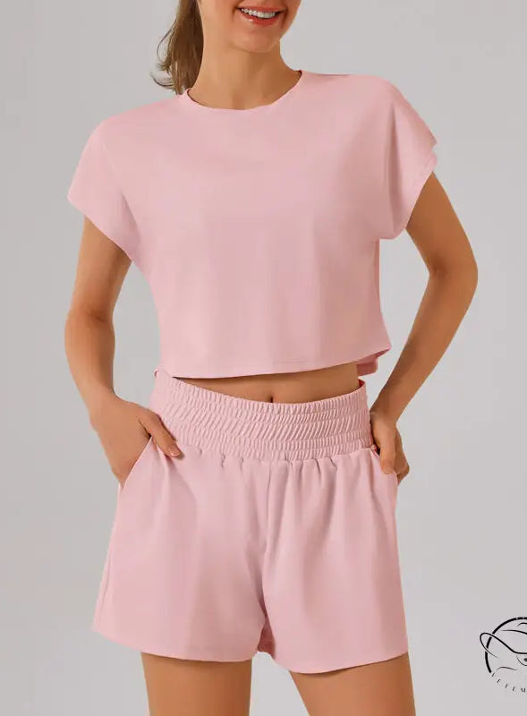 Pink loose sports yoga fitness set with crop top and shorts