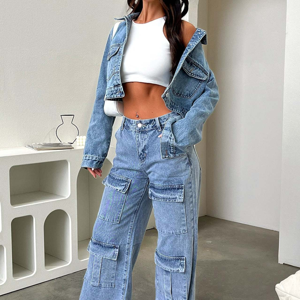 Matching denim jacket and wide-leg cargo jeans styled with a white crop top for fashion