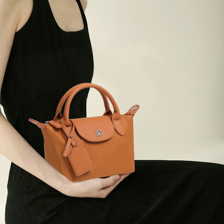 Orange leather handbag from Mini All Match Shoulder Bag, perfect for stylish fashion choices