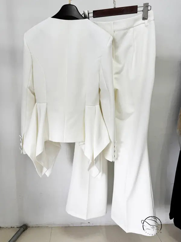 White asymmetrical langry fashion blouse with bell sleeves and high-waisted pants set