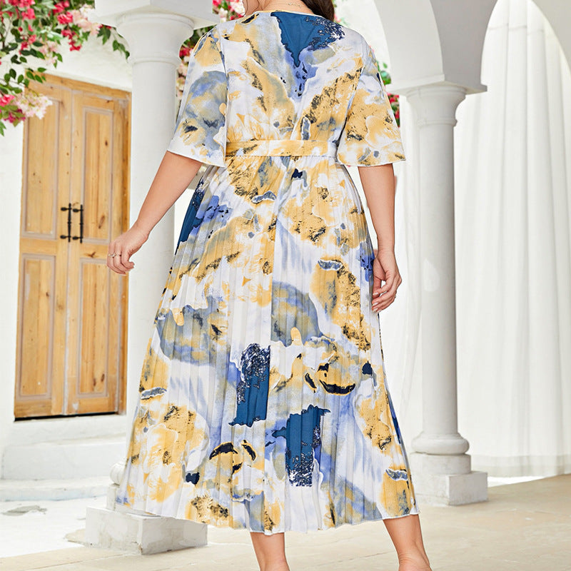Loose pleated long pattern dress with abstract print in yellow, blue, and white