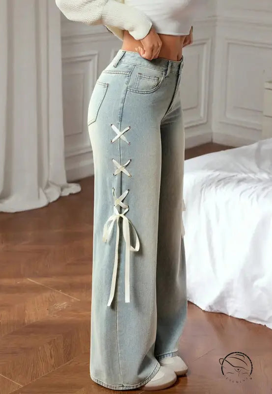 Casual wide leg jeans with light-wash denim and white lace-up seam design