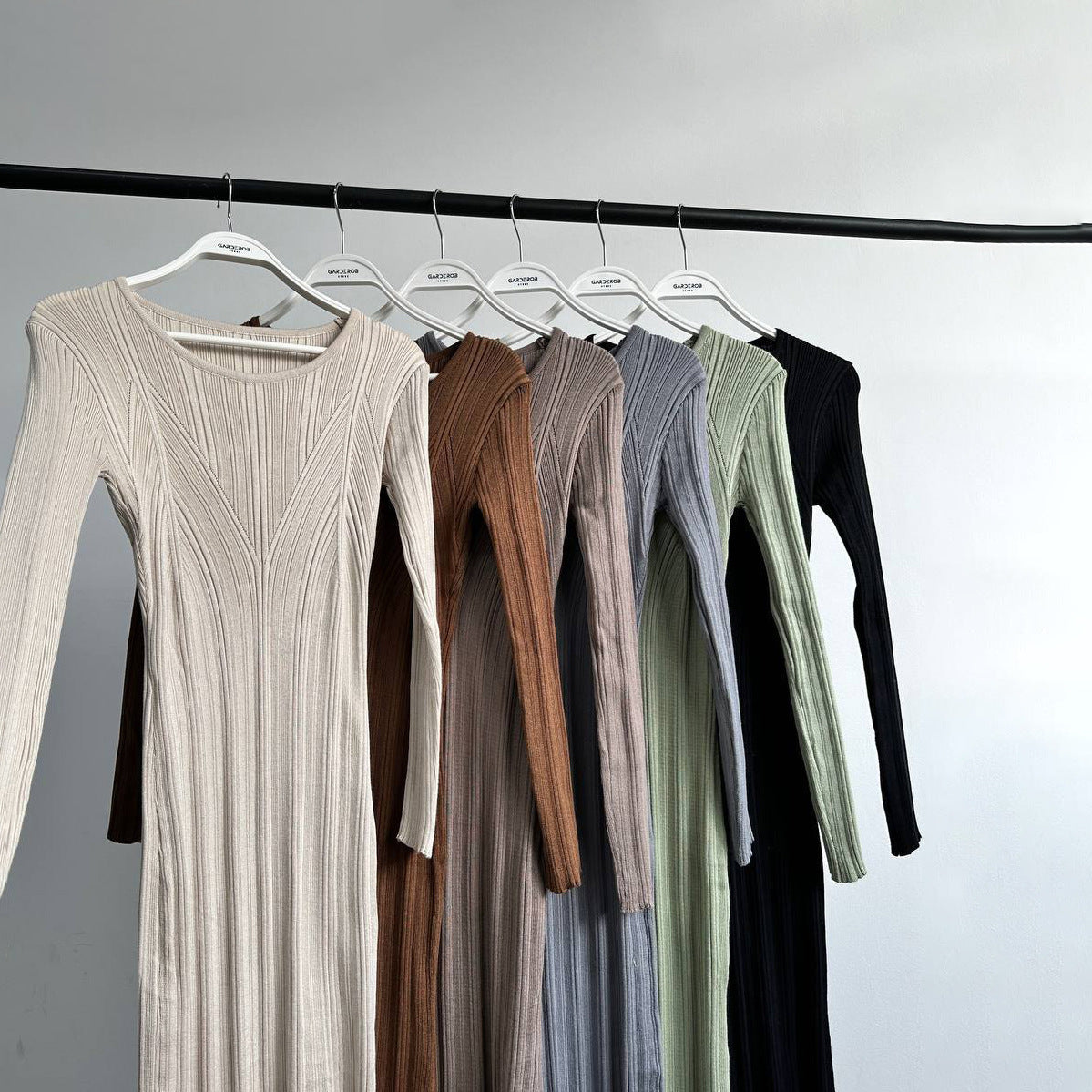 Row of ribbed knit dresses showcasing Beautiful Knitted Dress in trendy langry fashion ملابس