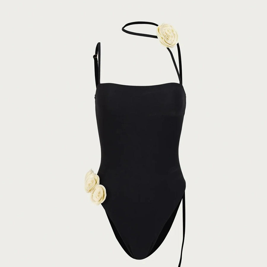 Black one-piece swimsuit with cream floral accents from Enchanting Beach Swimwear fashion