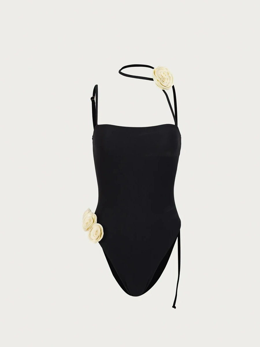 Black one-piece swimsuit with cream floral accents from Enchanting Beach Swimwear fashion