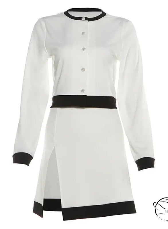 Elegant white and black long sleeve top with short skirt set