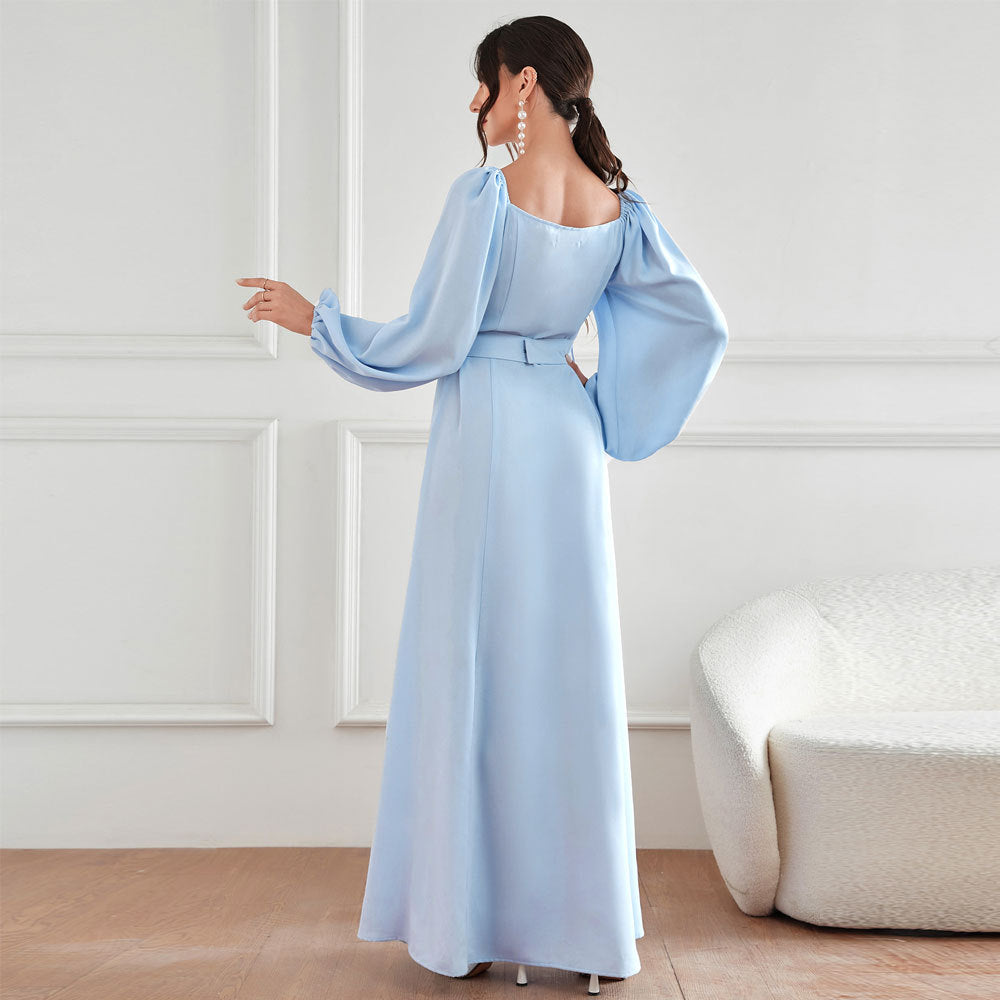 Elegant Langry high-waist fashion dress in light blue satin with puff sleeves, square neckline, belt, and rhinestones