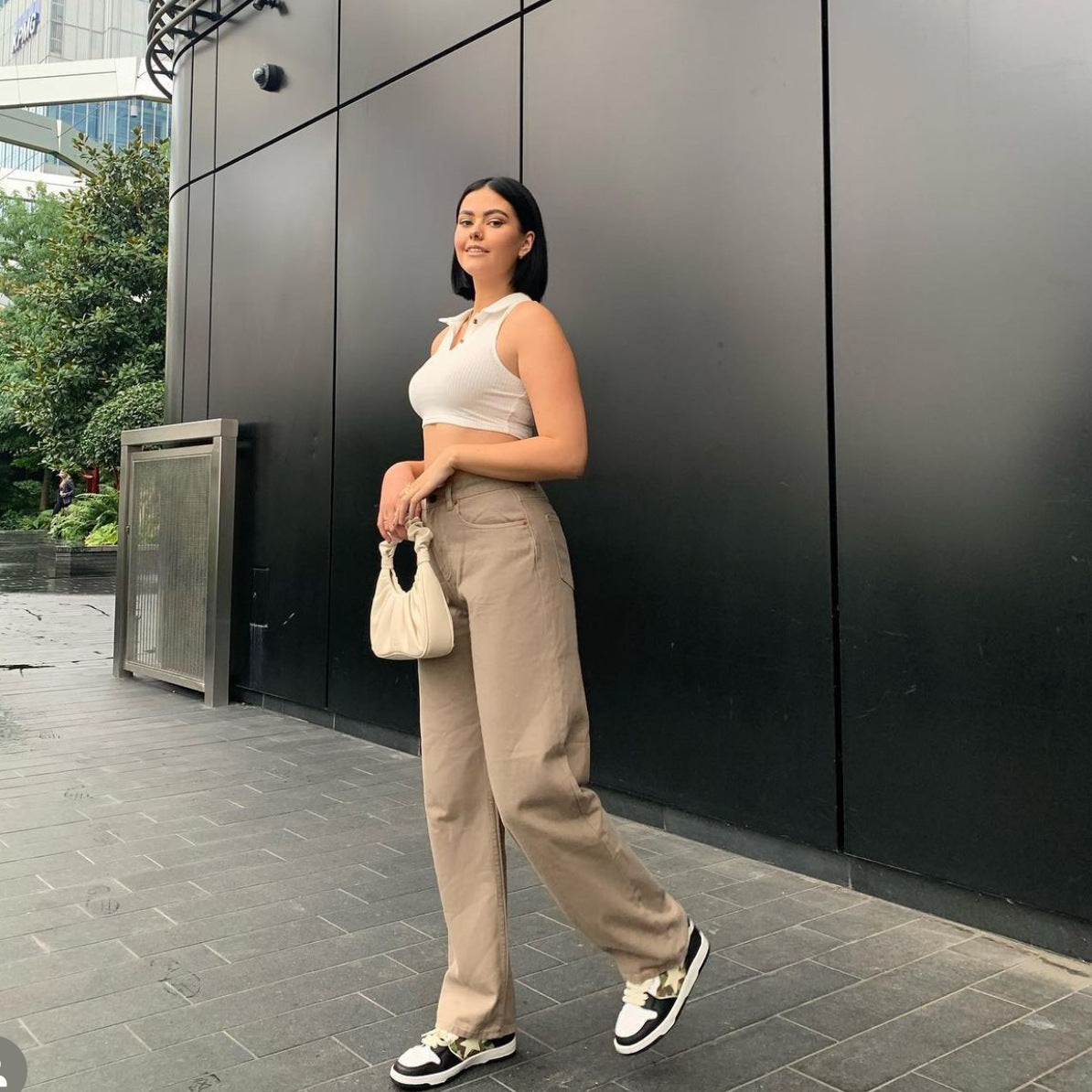 Woman’s casual outfit featuring Retro Light Khaki High Waist Draggle Tail Trousers for street smart fashion