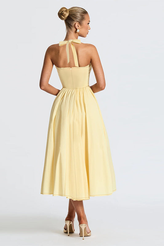 Langry yellow satin halter neck evening maxi dress with bow back detail