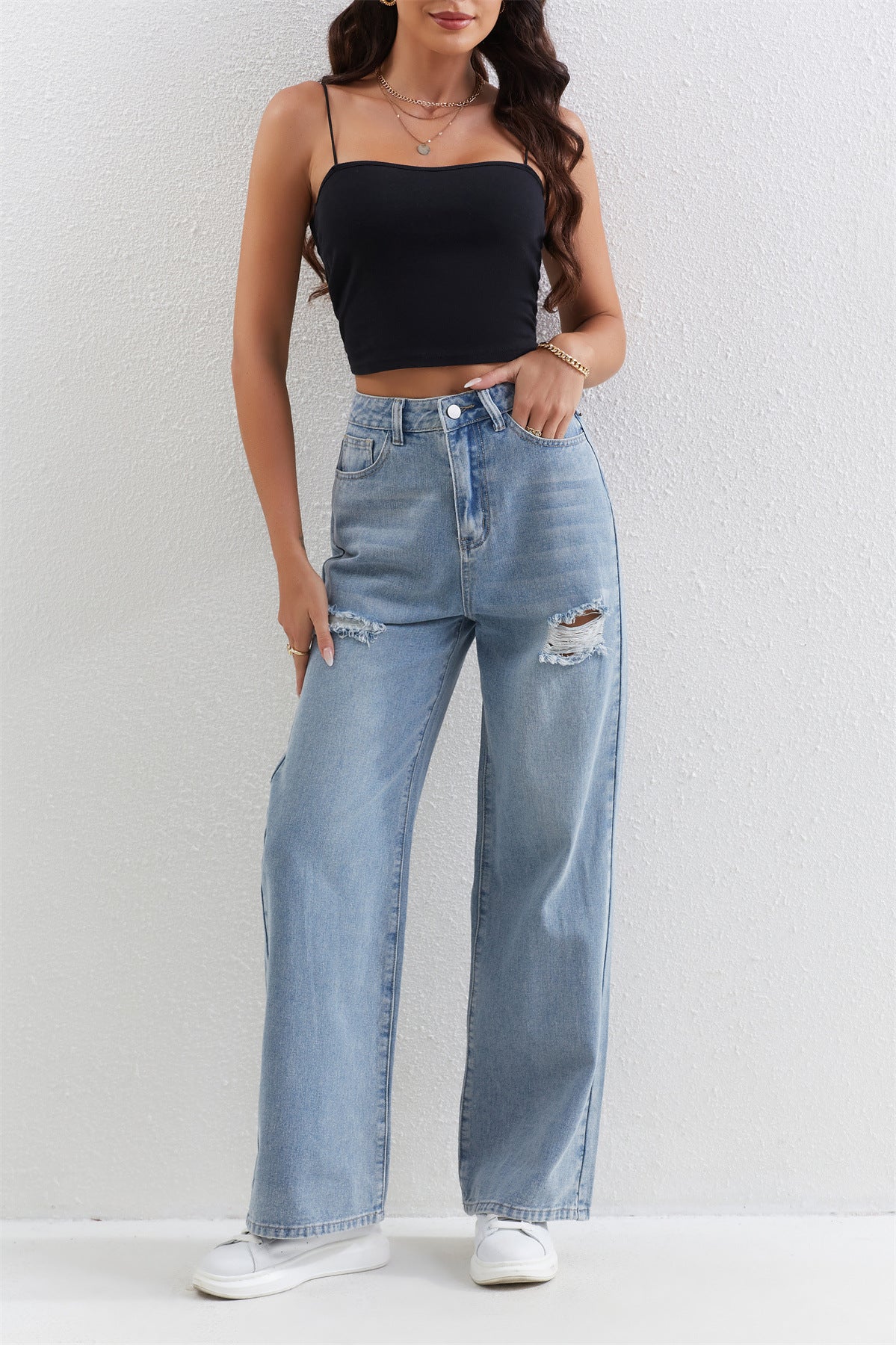 Light blue distressed wide-leg jeans with ripped knee detail for fashionable ملابس styling
