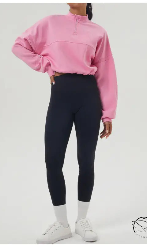 Woman in pink autumn winter thickened sweater and black leggings