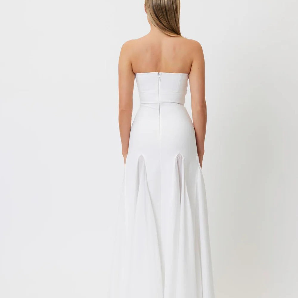 Strapless white formal gown featuring fitted bodice and flowing pants for elegant fashion ملابس