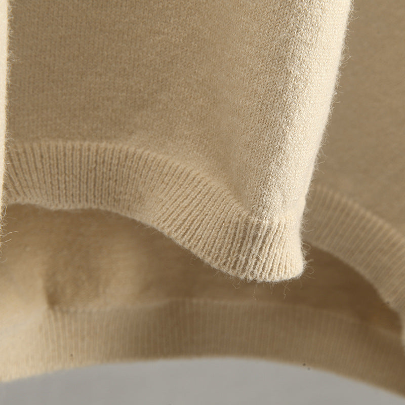 Close-up of a cream-colored ribbed knit sweater from Warm Polo Collar Knitted Sweater collection, perfect for fashion and ملابس