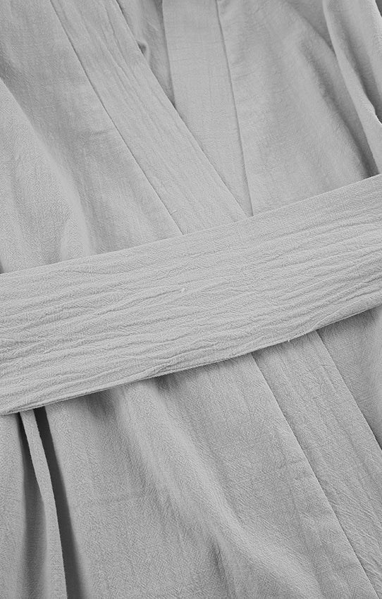 Light grey textured cotton bathrobe with tied belt, ideal for loose casual cotton pajamas
