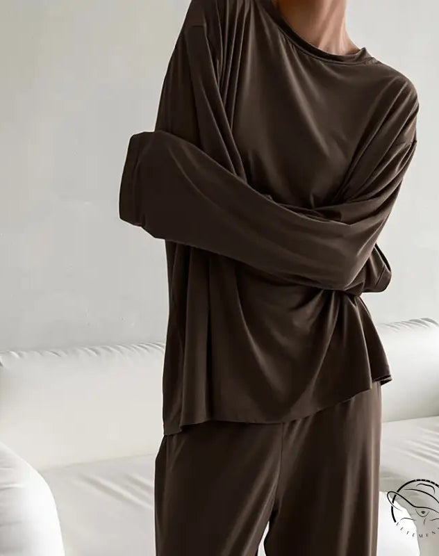 Woman in round neck knitted loose casual pajamas suit with long sleeves and pants