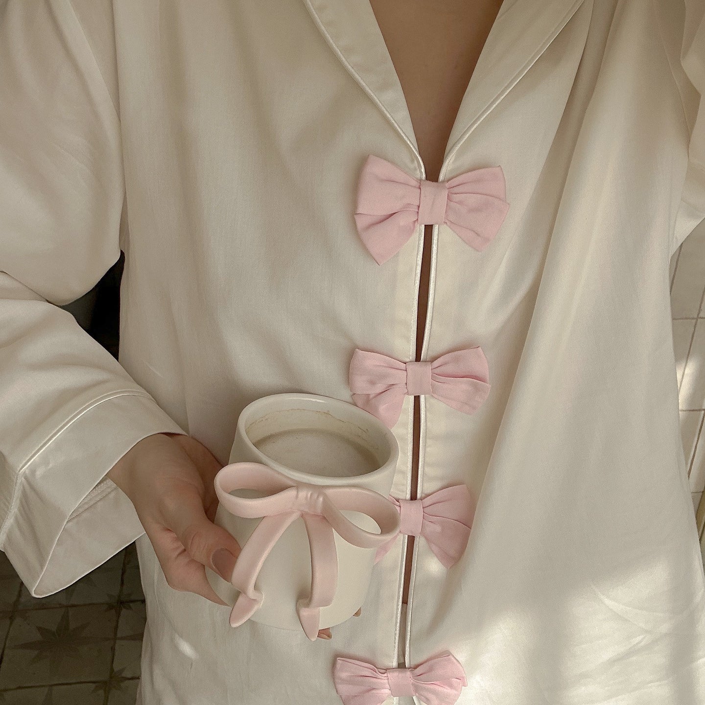 Elegant langry fashion white silk robe with pink bow accents, pearl necklace, pajamas set