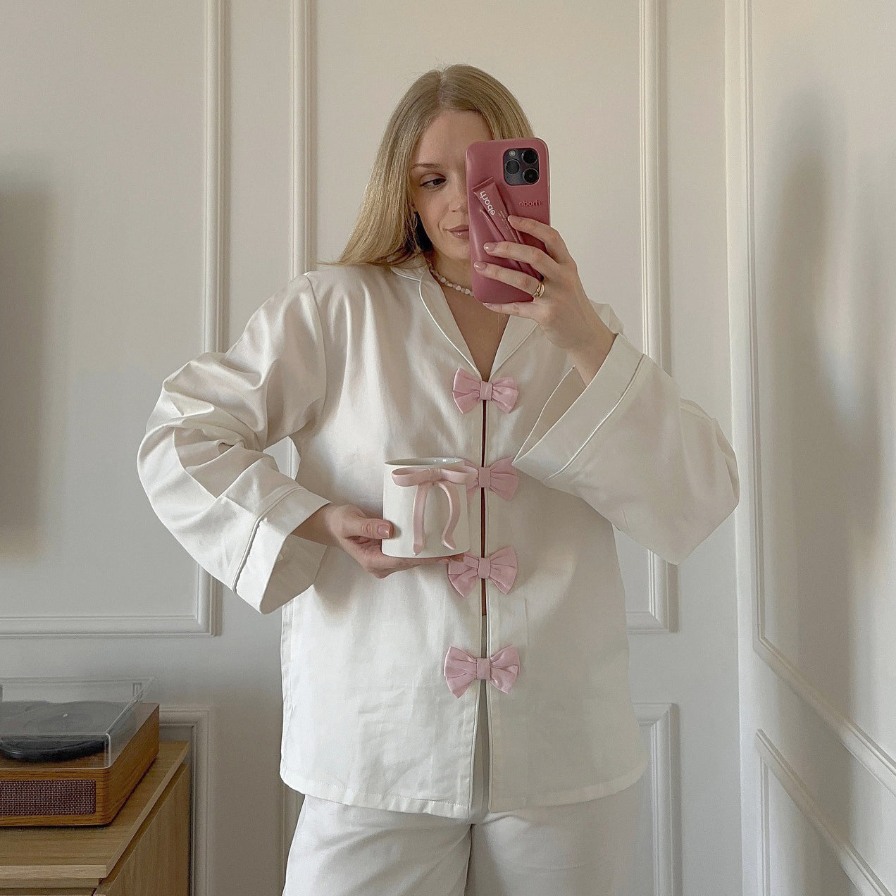 White satin langry pajama set with pink bow accents