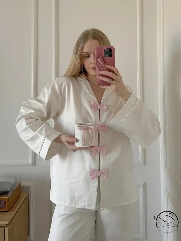 Elegant white satin langry pajama set with pink accents and bow details