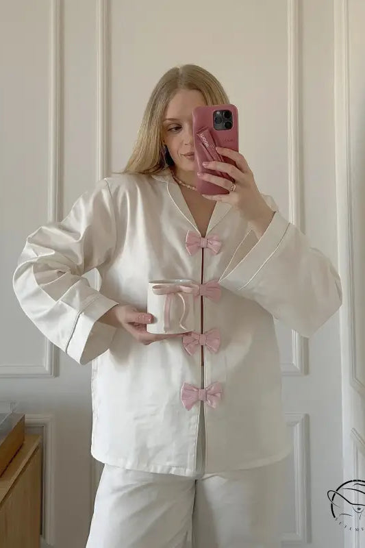 Elegant white satin langry pajama set with pink accents and bow details