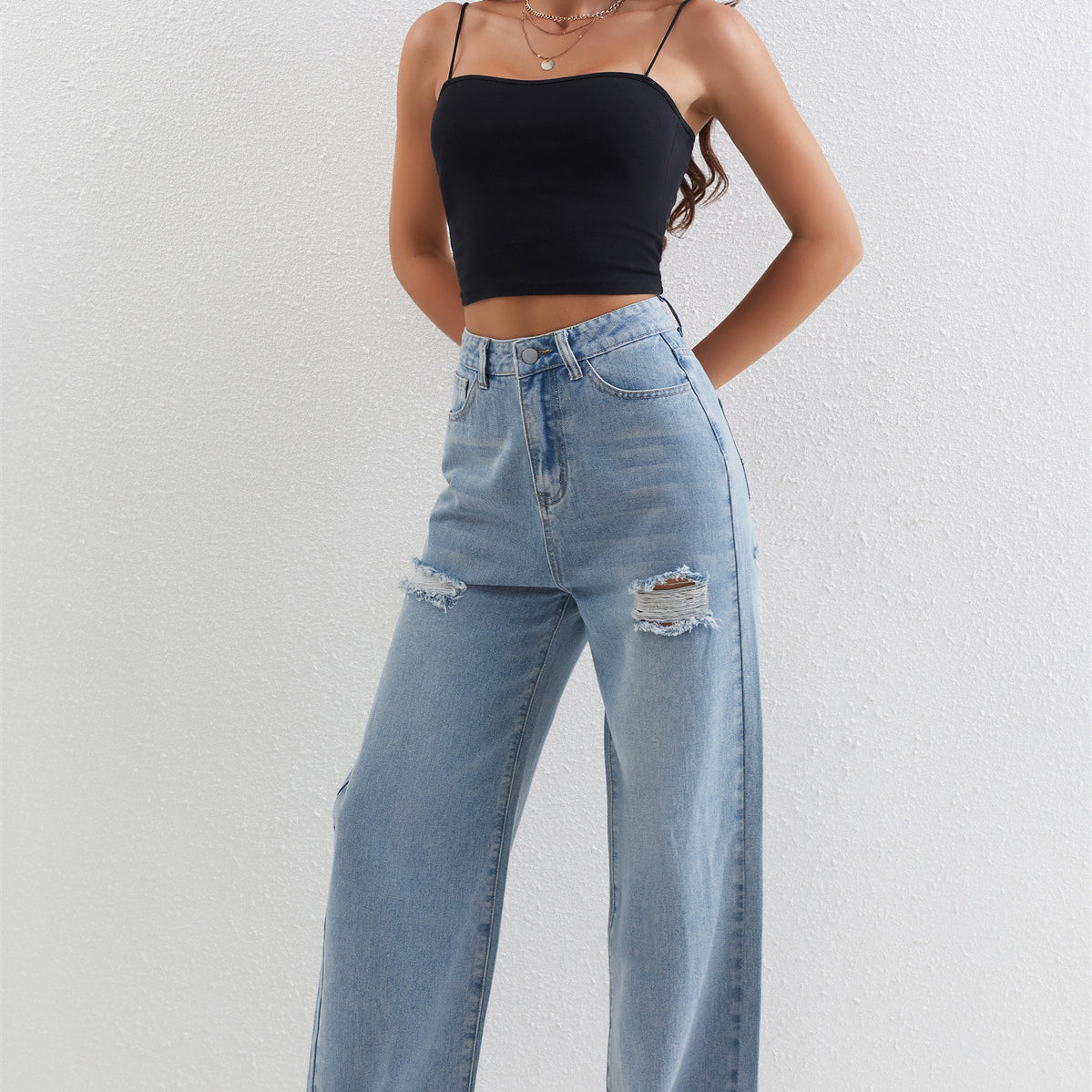 Light blue distressed wide-leg jeans with thigh rips, trendy fashion ملابس for casual wear