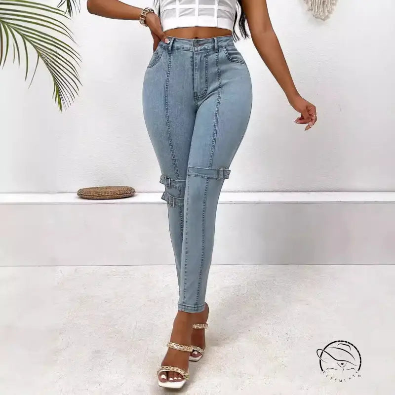 High elastic skinny jeans in light blue denim with buckle details