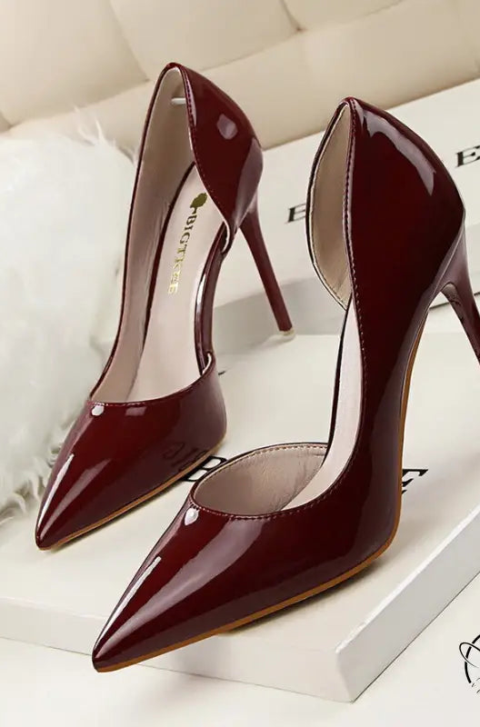 Glossy burgundy patent leather low cut high heels with pointed toes