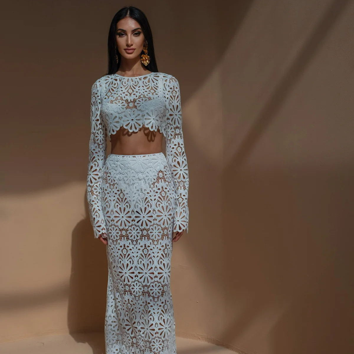 Woman in slim fit hollow out lace tops skirt two-piece set in white