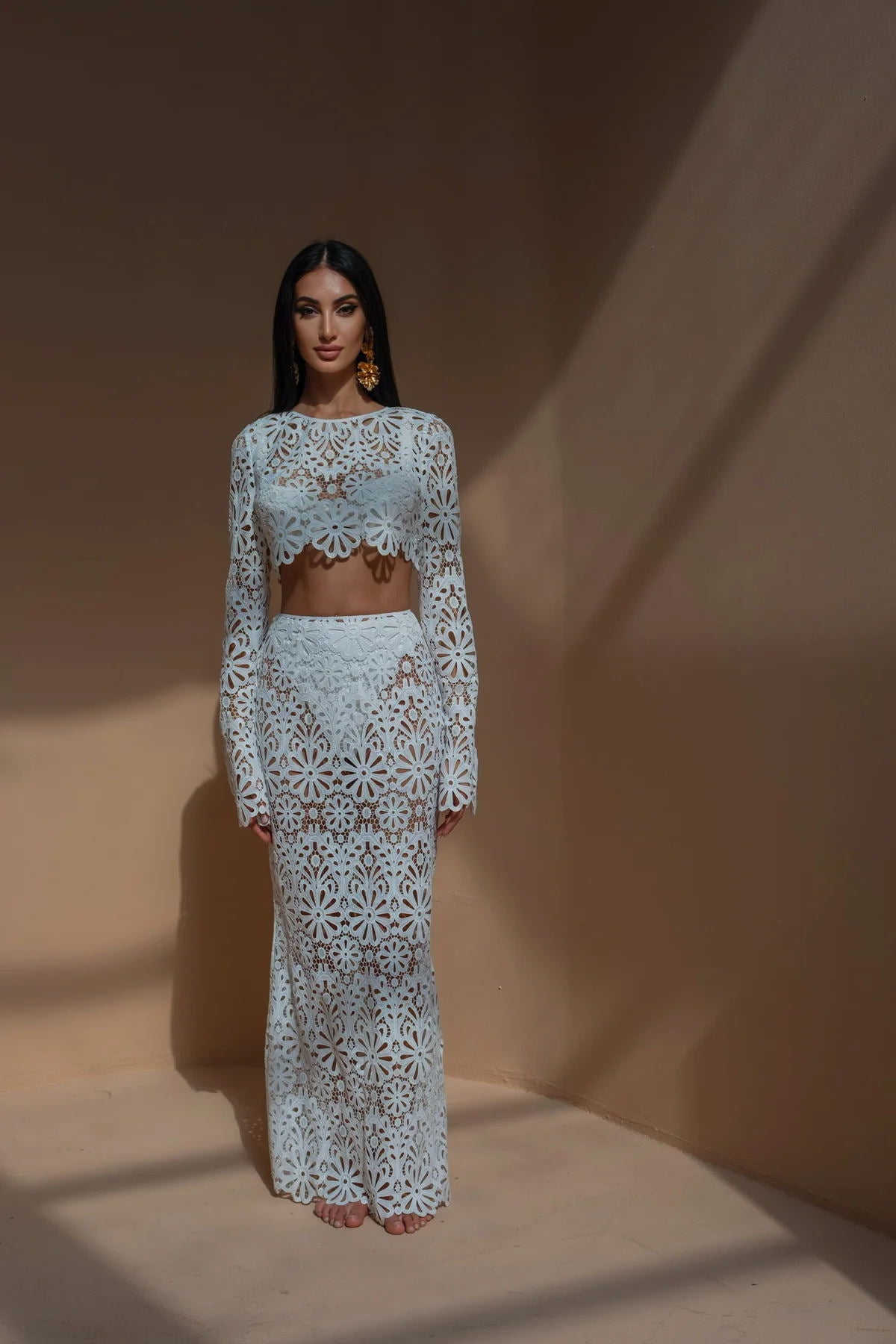 Woman in slim fit hollow out lace tops skirt two-piece set in white
