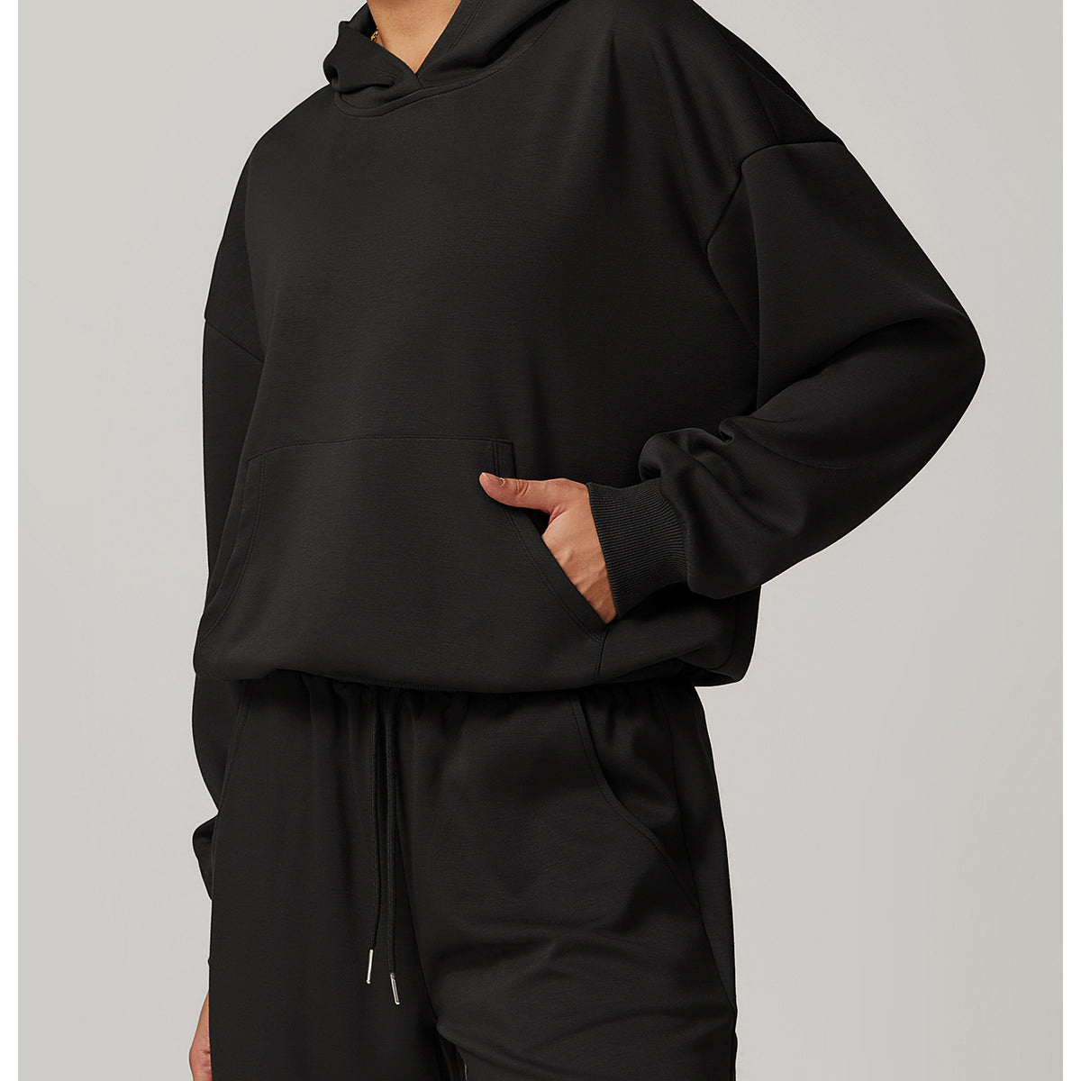 Black hooded sweatshirt and sweatpants set from Langry, perfect for casual fashion