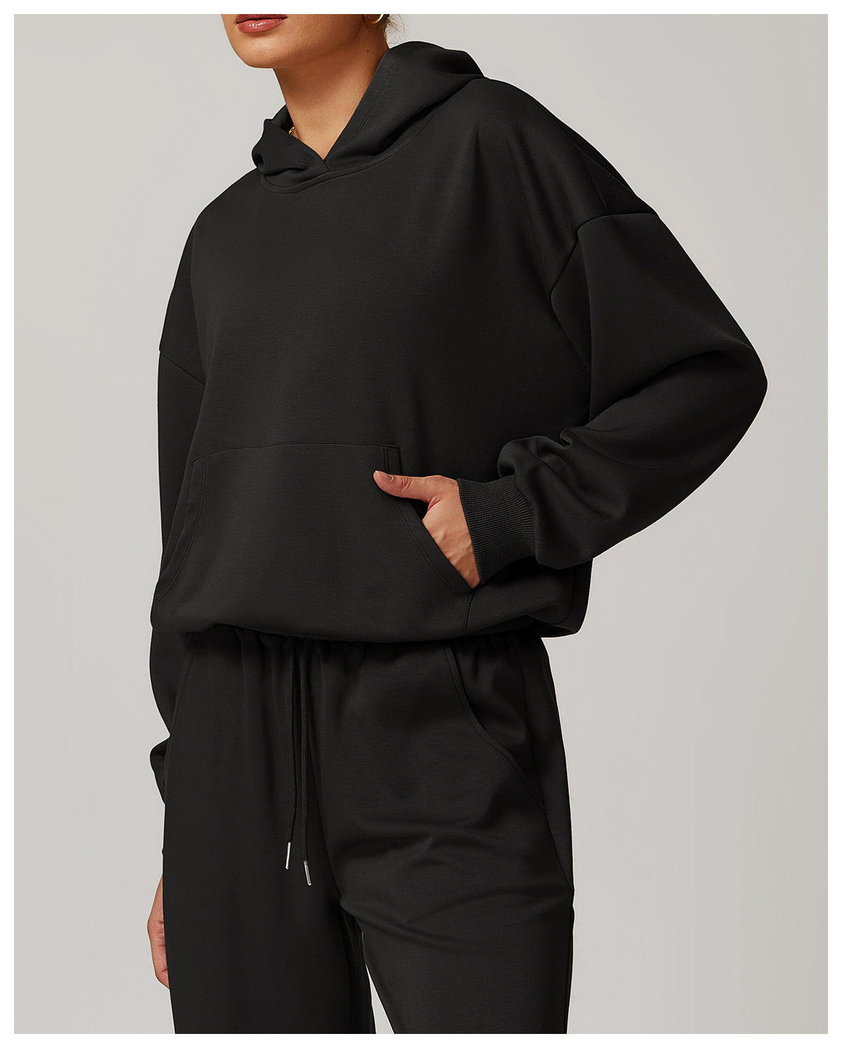 Black hooded sweatshirt and sweatpants set from Langry, perfect for casual fashion