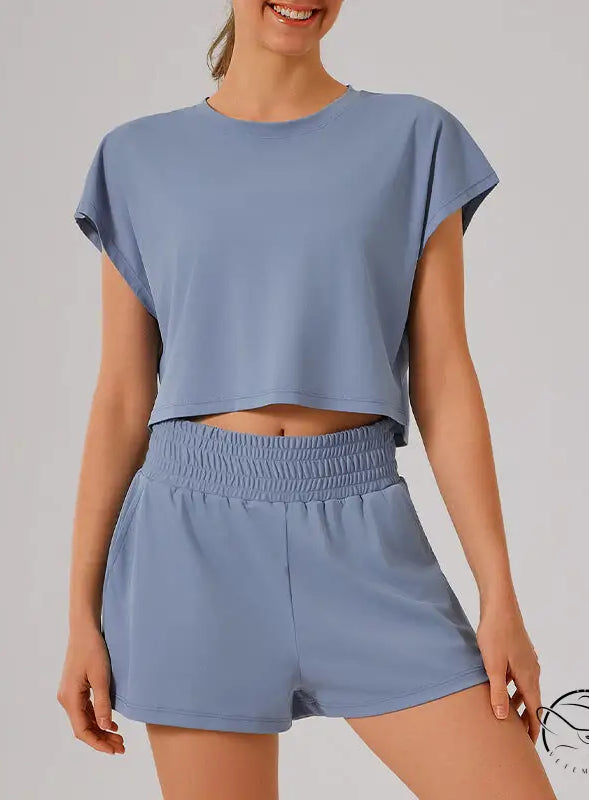 Light blue loose sports yoga fitness set with crop top and shorts