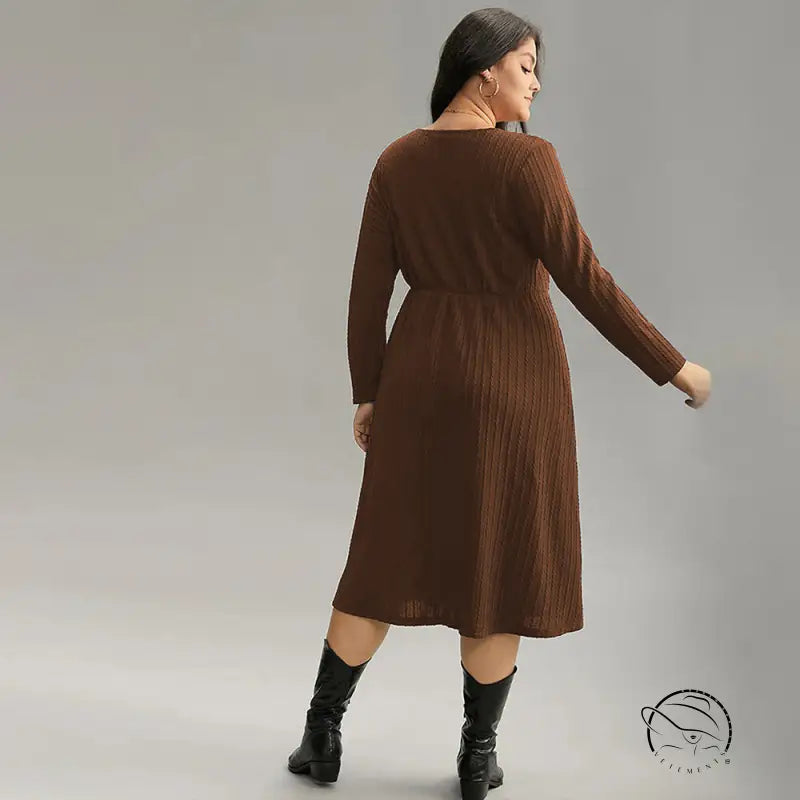 Brown ribbed plus-size long-sleeve midi office dress with elastic waist and black boots