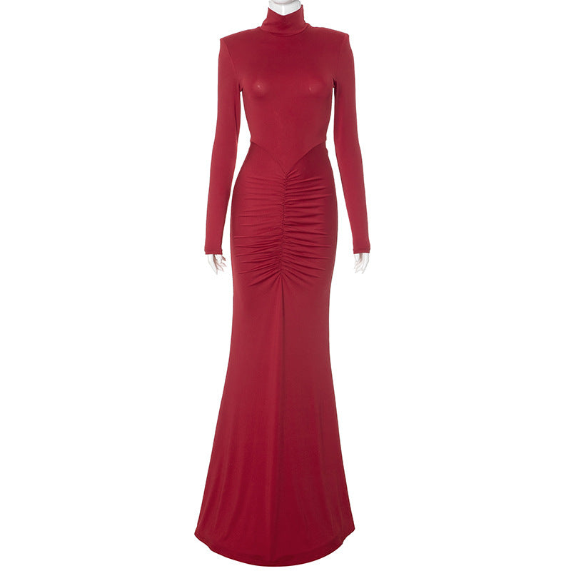 Elegant red fishtail dress with ruched turtleneck, perfect for fashionable langry occasions