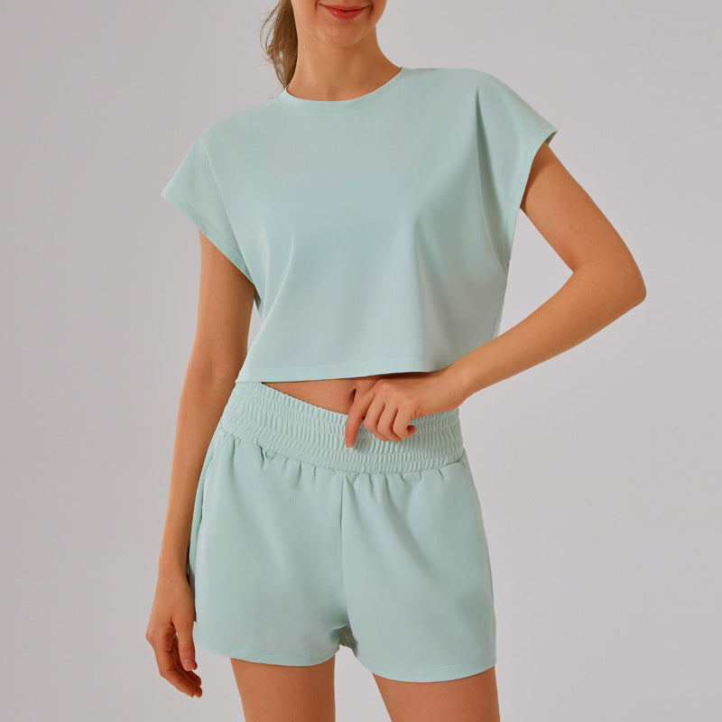 Mint green crop top and shorts matching set in Loose Sports Yoga Fitness Set for fashion enthusiasts