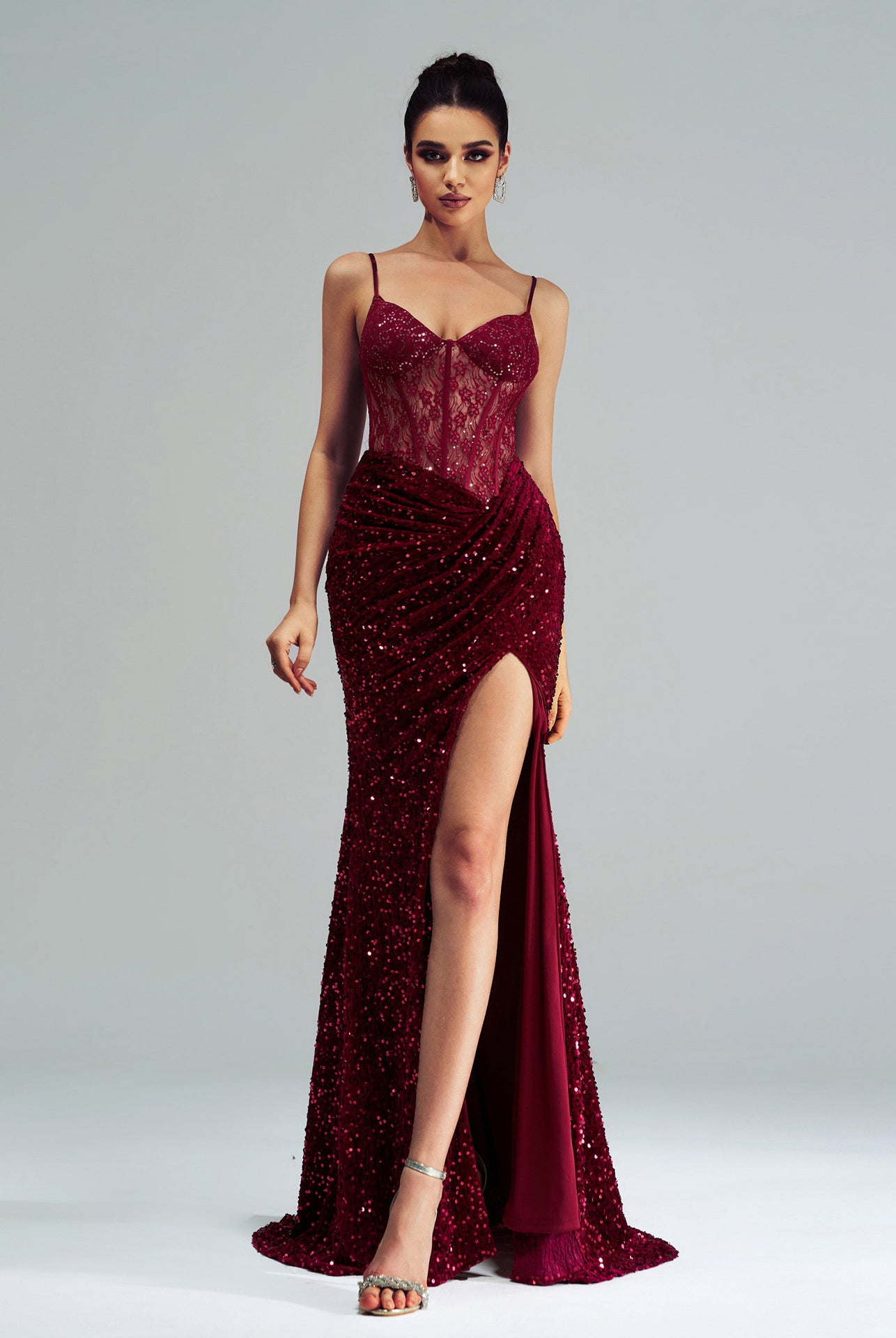 Burgundy sequined evening gown with corset bodice and high slit for elegant fashion ملابس