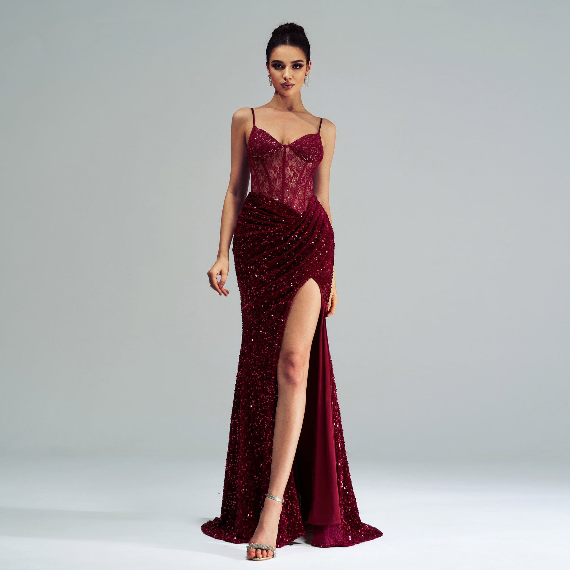 Burgundy sequined evening gown with corset bodice and high slit for elegant fashion ملابس