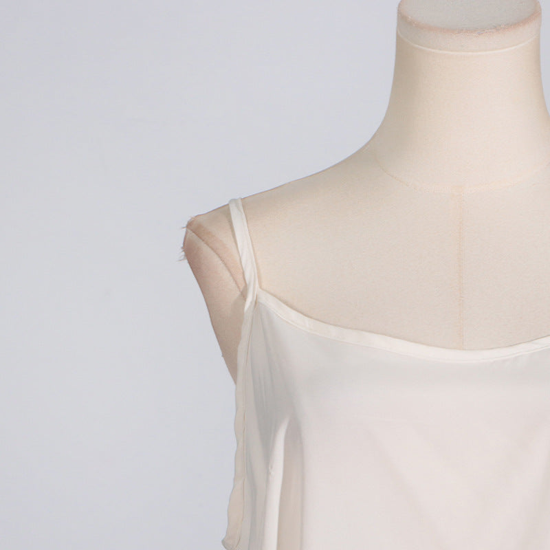 Cream-colored camisole on mannequin showcasing elegant French Stitching Lace fashion style