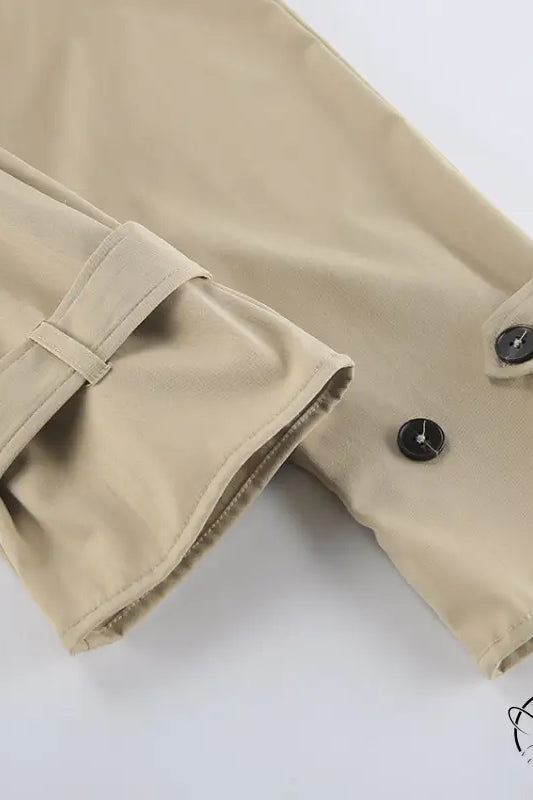 British long sleeve high sense mid length trench coat in khaki with buttoned cuffs and belt loops