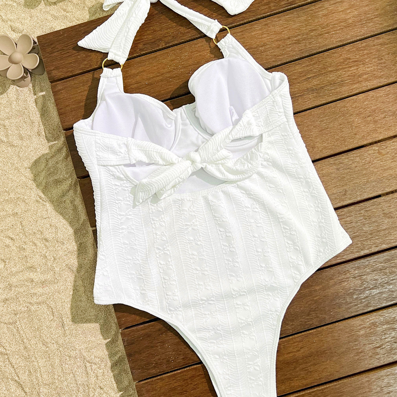Elegant White Halter-Neck One-Piece Swimsuit with Bow Detail, a stylish fashion choice