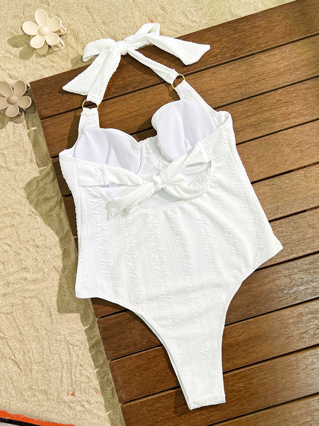 Elegant White Halter-Neck One-Piece Swimsuit with Bow Detail, a stylish fashion choice