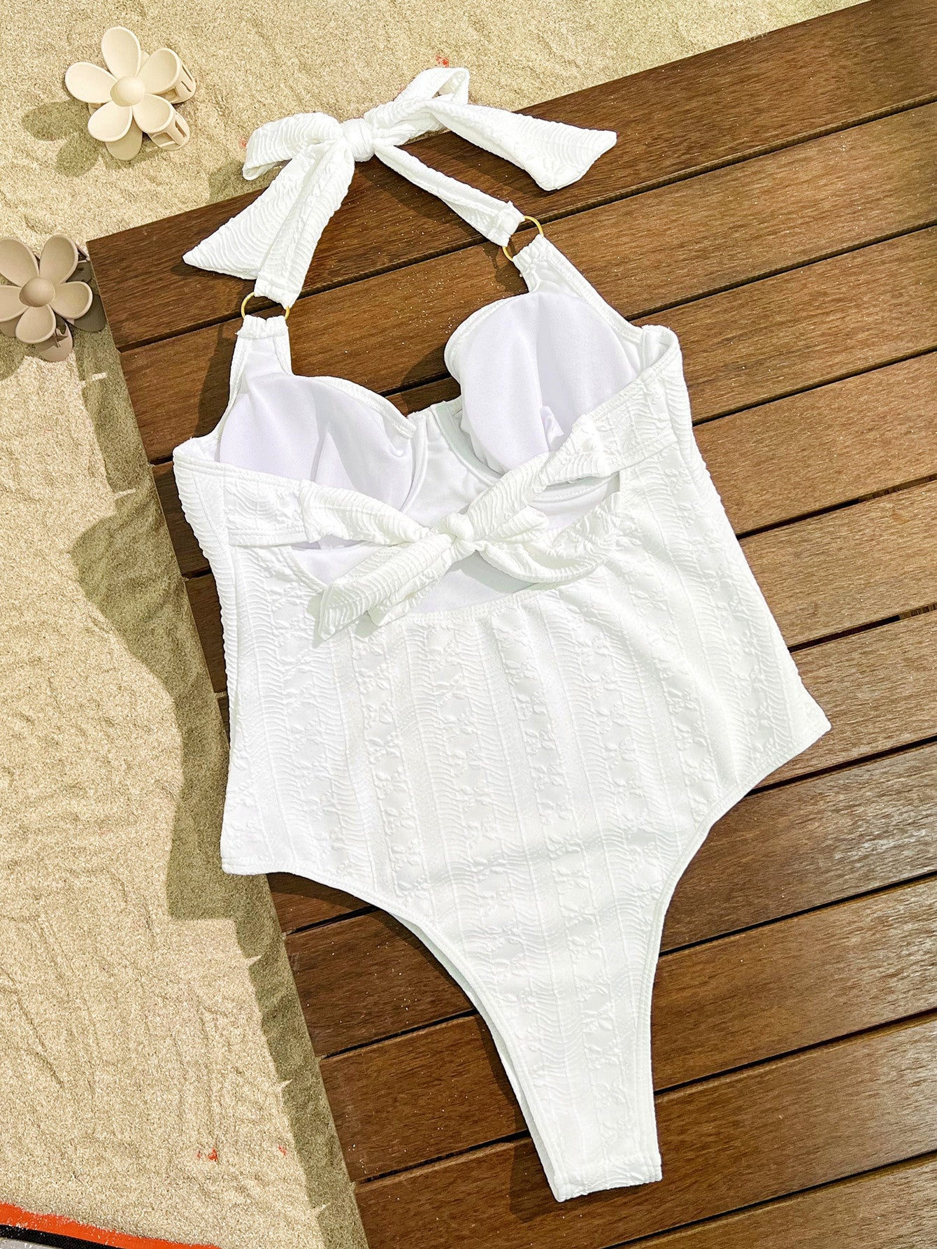 Elegant White Halter-Neck One-Piece Swimsuit with Bow Detail, a stylish fashion choice