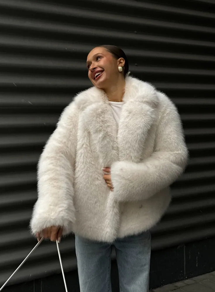 White fluffy faux fur coat with high collar and long sleeves for winter fashion