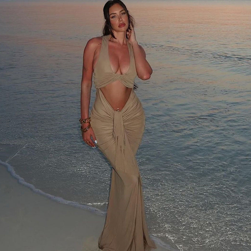 Person in beige two-piece beach outfit showcasing Elegant Tight Halter Dress fashion