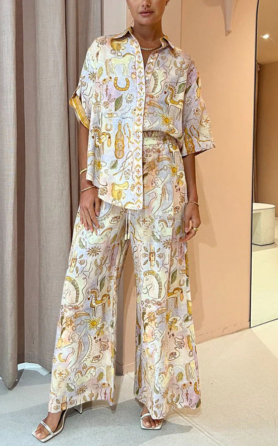 Woman wearing stylish patterned pajama set from Summer Casual Pocket Two Piece Suit