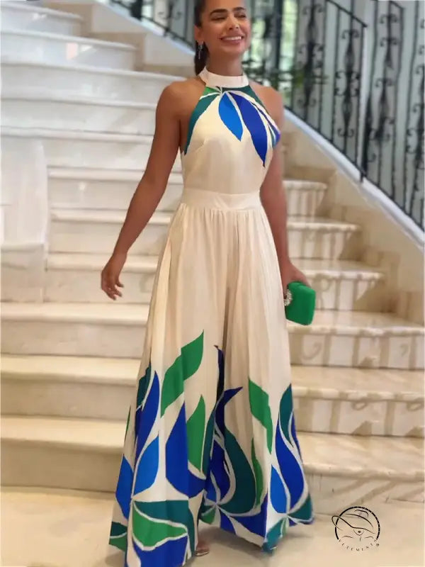 White halter neck maxi dress in summer printed blue green leaf design