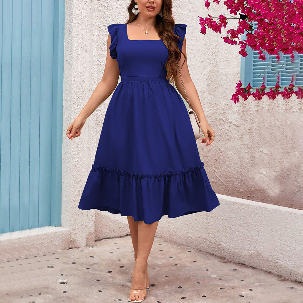 Elegant woman in royal blue Vacation Casual Midi Dress showcasing fashionable ملابس and style