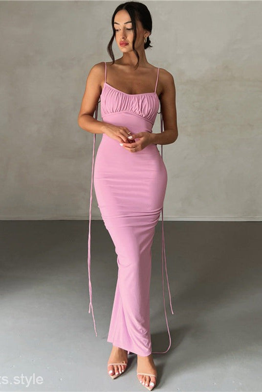 Elegant slim fit sheath dress in a vibrant pink color with spaghetti straps