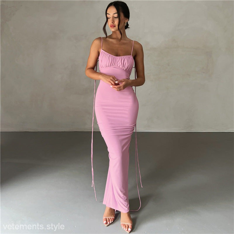 Elegant slim fit sheath dress in a vibrant pink color with spaghetti straps