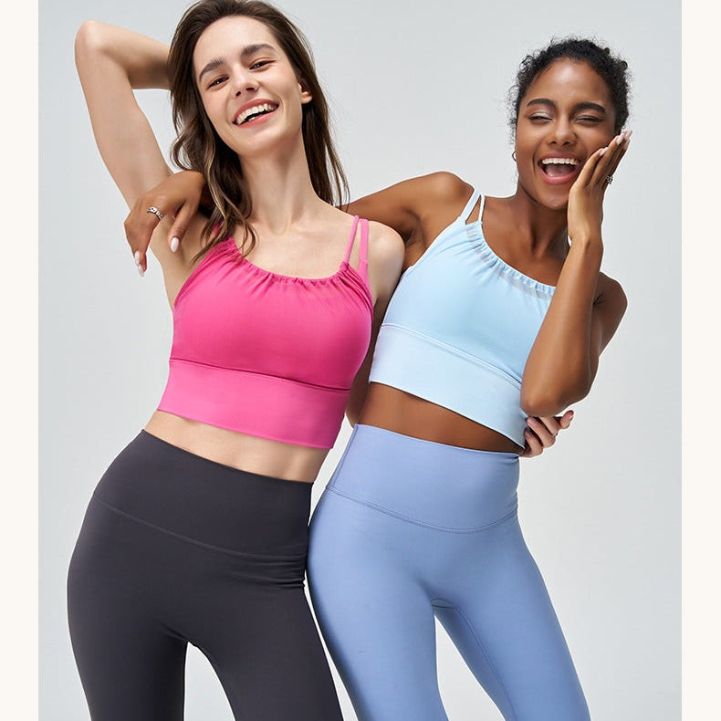 Two women in athletic wear showcasing the Cute Pleated Mesh Yoga Vest in Glacier Blue