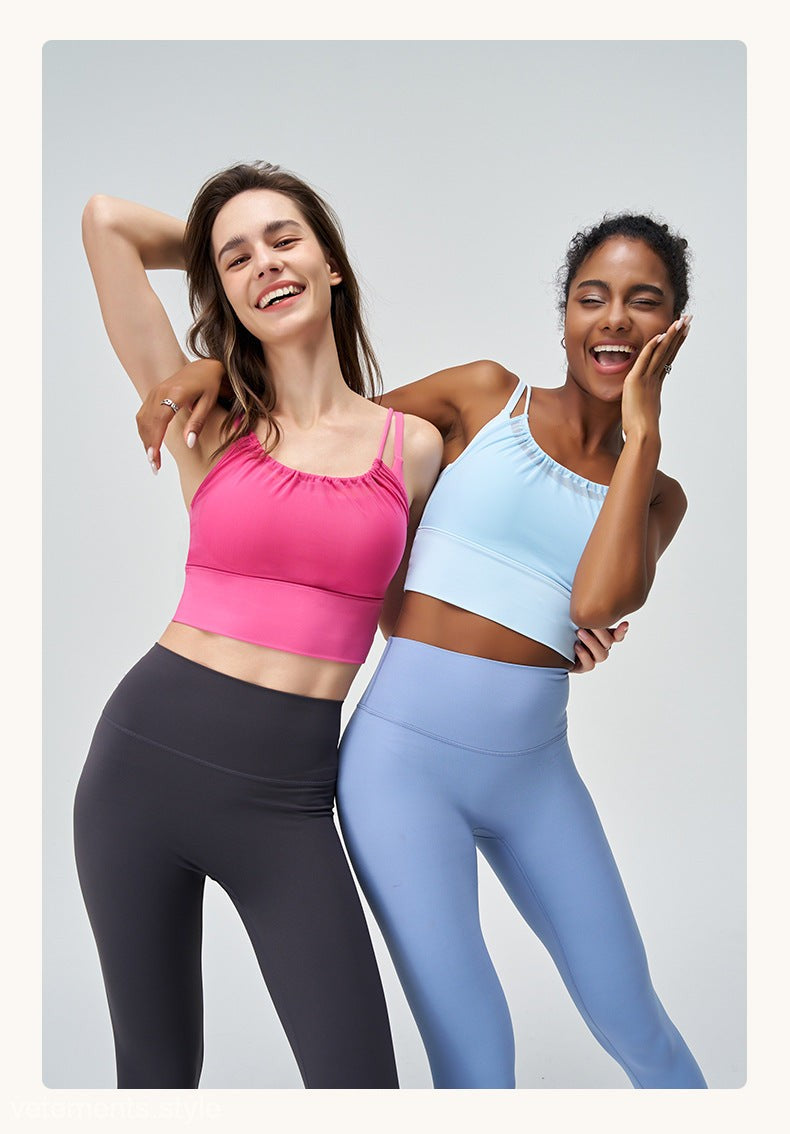 Two women in athletic wear showcasing the Cute Pleated Mesh Yoga Vest in Glacier Blue